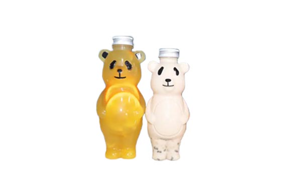 Bulk sale 700ml cartoon PET panada shape creative juice bottles with caps for juice/milk tea