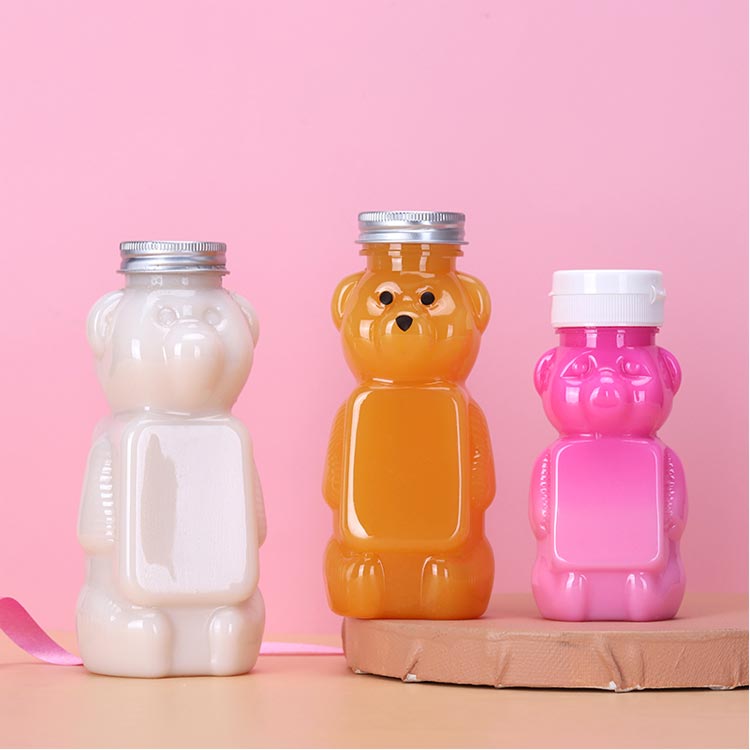 Wholesale custom size clear 250ml PET plastic bear juice bottles with caps