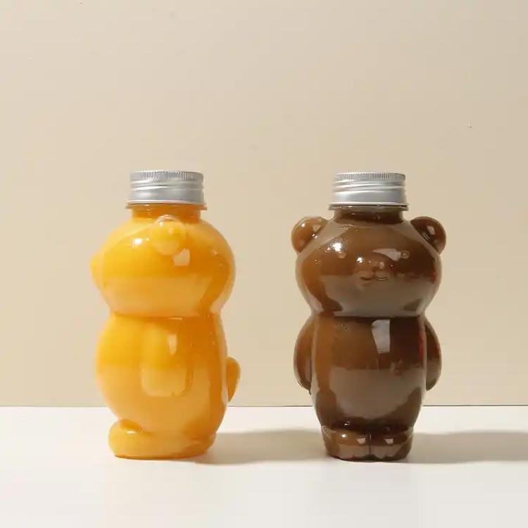 Wholesale custom size clear 250ml PET plastic bear juice bottles with caps