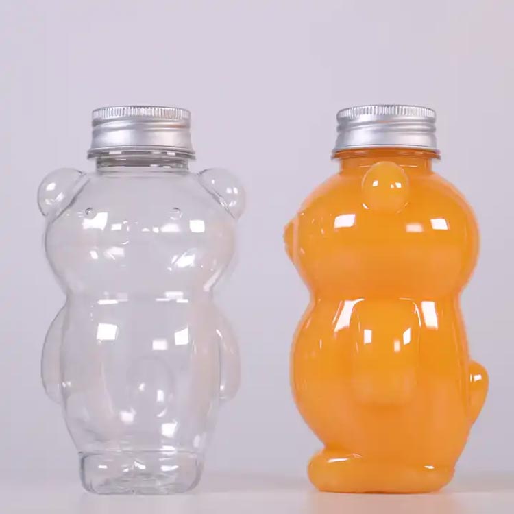 Wholesale custom size clear 250ml PET plastic bear juice bottles with caps