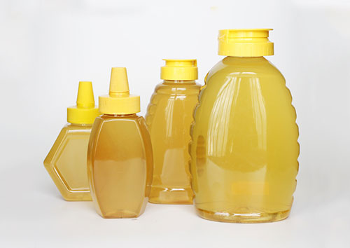 plastic queenline jar for honey storage with yellow sealed lids