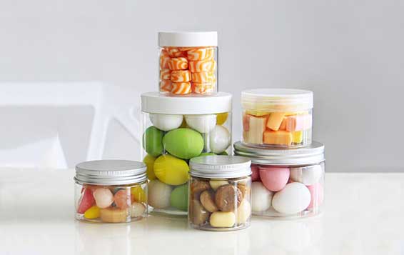 Round clear plastic storage jars with screw lids for kitchen